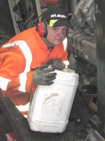 Chris B filling the power unit with oil