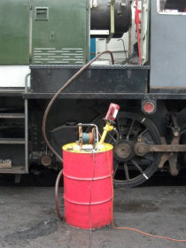 Transmission oil being refilled